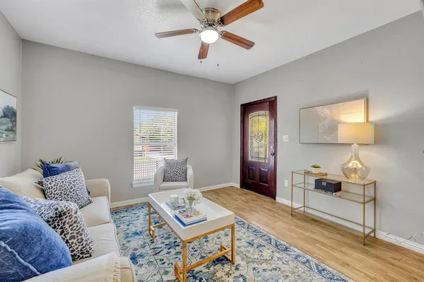 a living room with furniture and a window