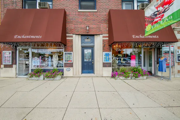 a view of store with outdoor seating