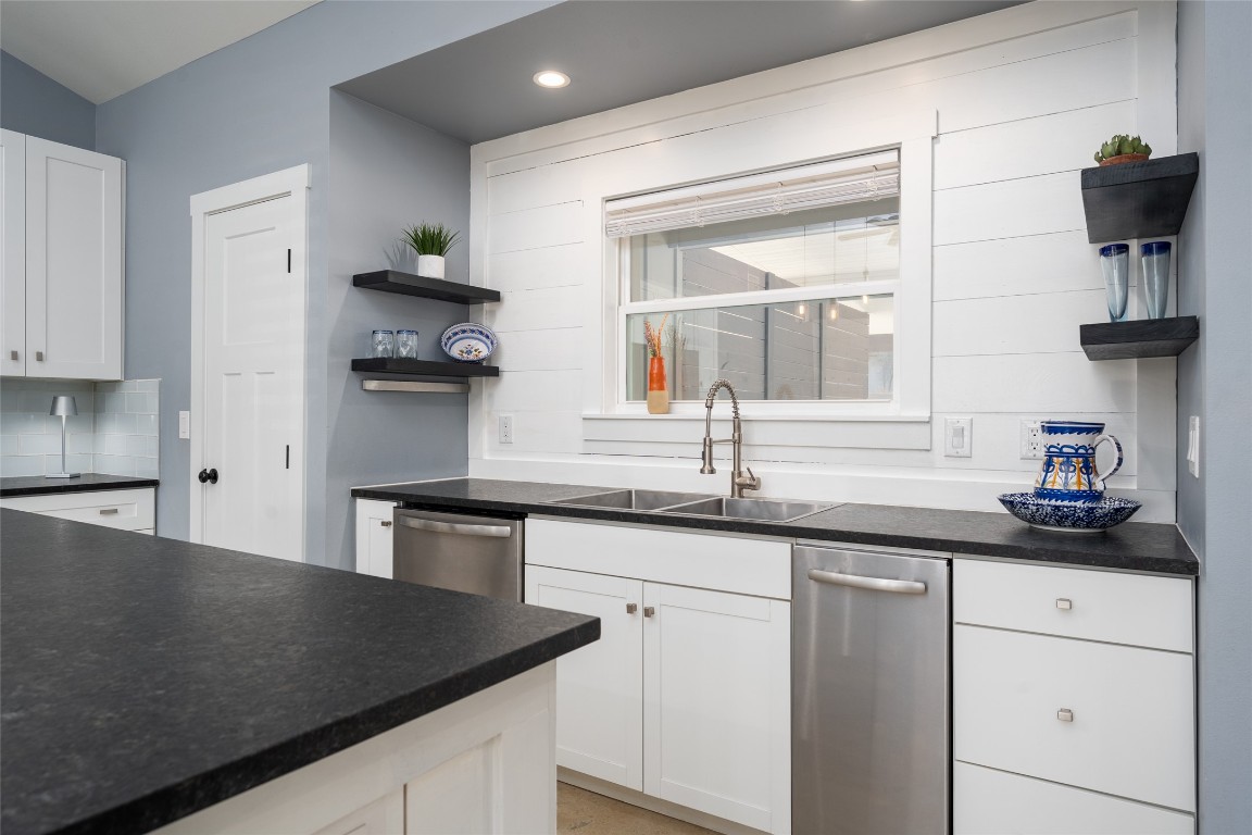 33 Deer Ridge Road Wimberley, TX 78676 - Photo 13 of 40 a kitchen with stainless steel appliances a sink stove and cabinets