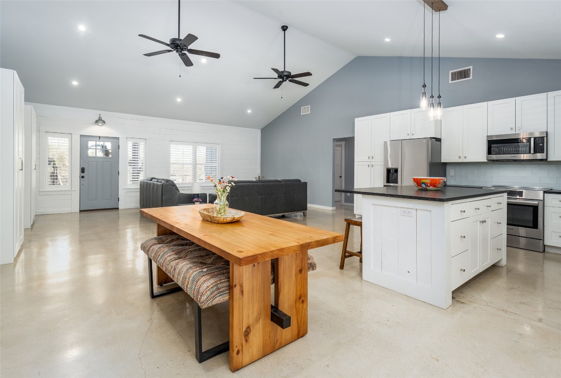 33 Deer Ridge Road Wimberley, TX 78676 - Photo 40 of 40 a kitchen that has a lot of cabinets and wooden floor