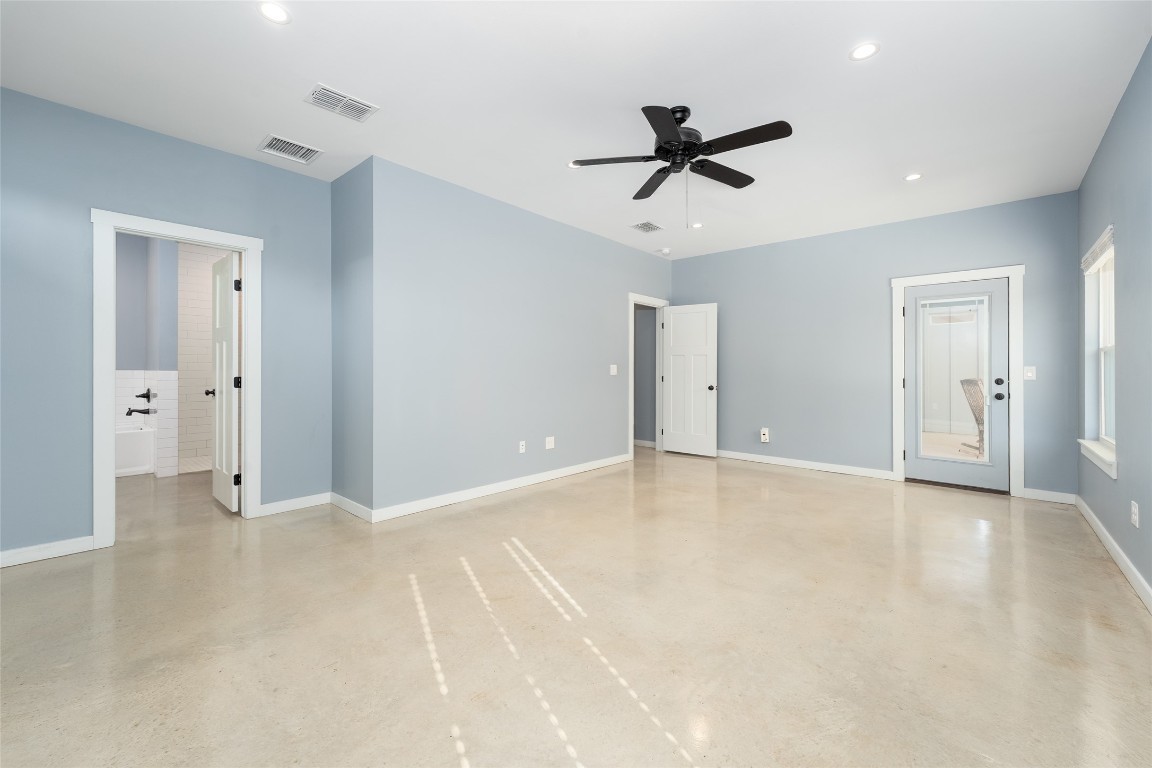 33 Deer Ridge Road Wimberley, TX 78676 - Photo 19 of 40 a view of an empty room with a ceiling fan