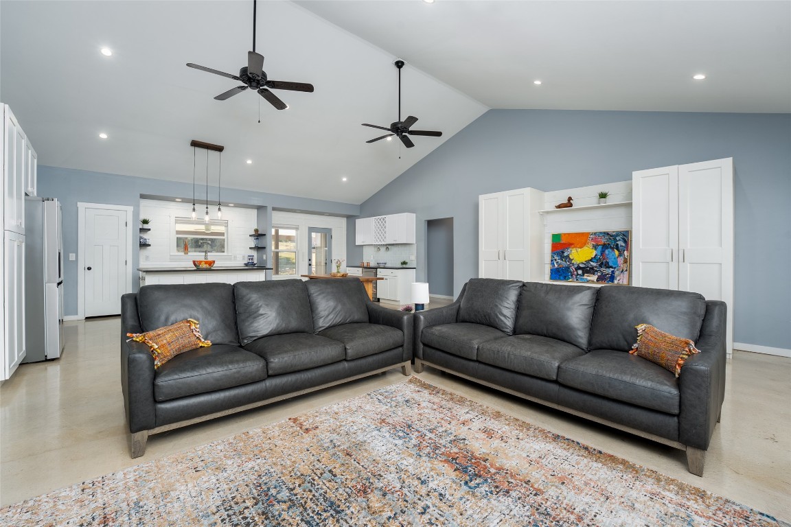 33 Deer Ridge Road Wimberley, TX 78676 - Photo 8 of 40 a living room with furniture and a ceiling fan