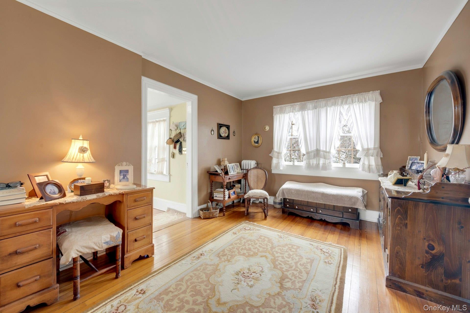 343 Rye Beach Avenue Rye, NY 10580 - Photo 19 of 35 a bedroom with furniture and a large window