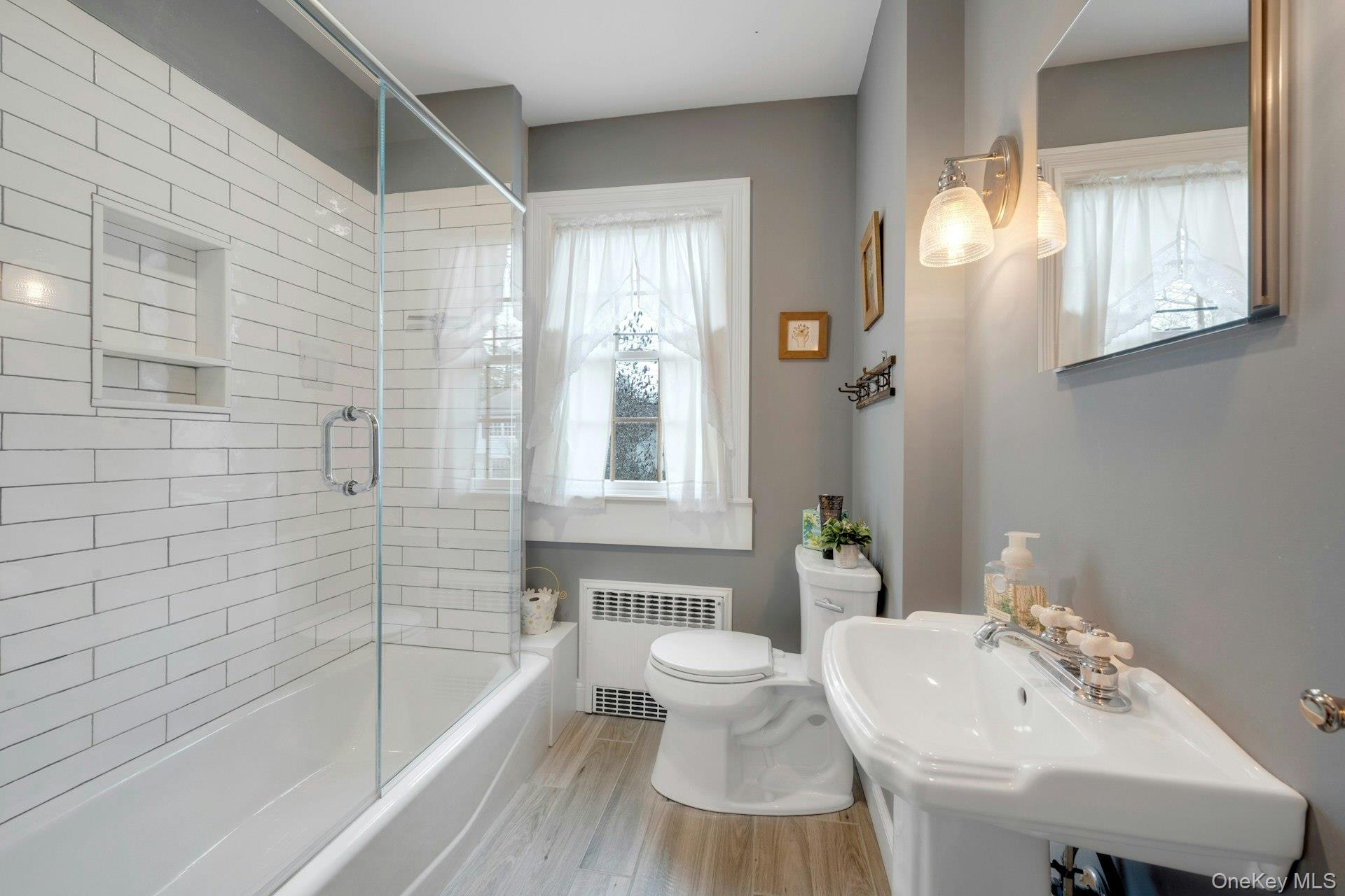 343 Rye Beach Avenue Rye, NY 10580 - Photo 25 of 35 a bathroom with a sink toilet and shower