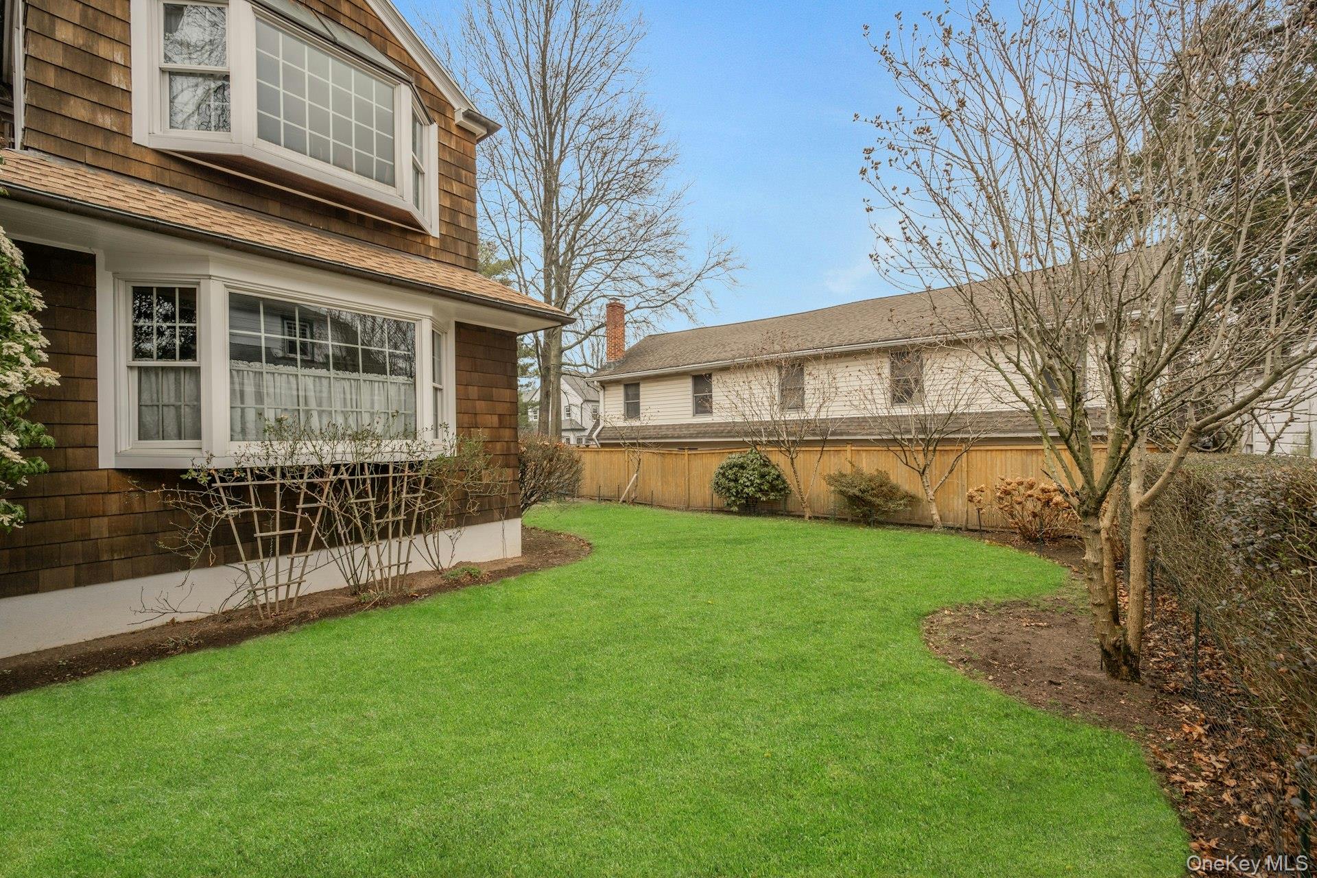 343 Rye Beach Avenue Rye, NY 10580 - Photo 30 of 35 a view of house with a yard and sitting area