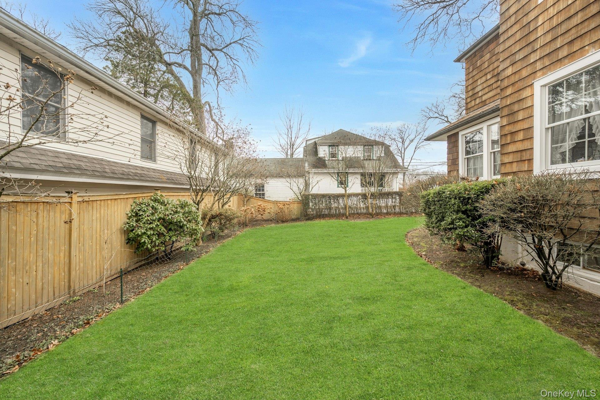 343 Rye Beach Avenue Rye, NY 10580 - Photo 31 of 35 a view of a house with a yard and sitting area