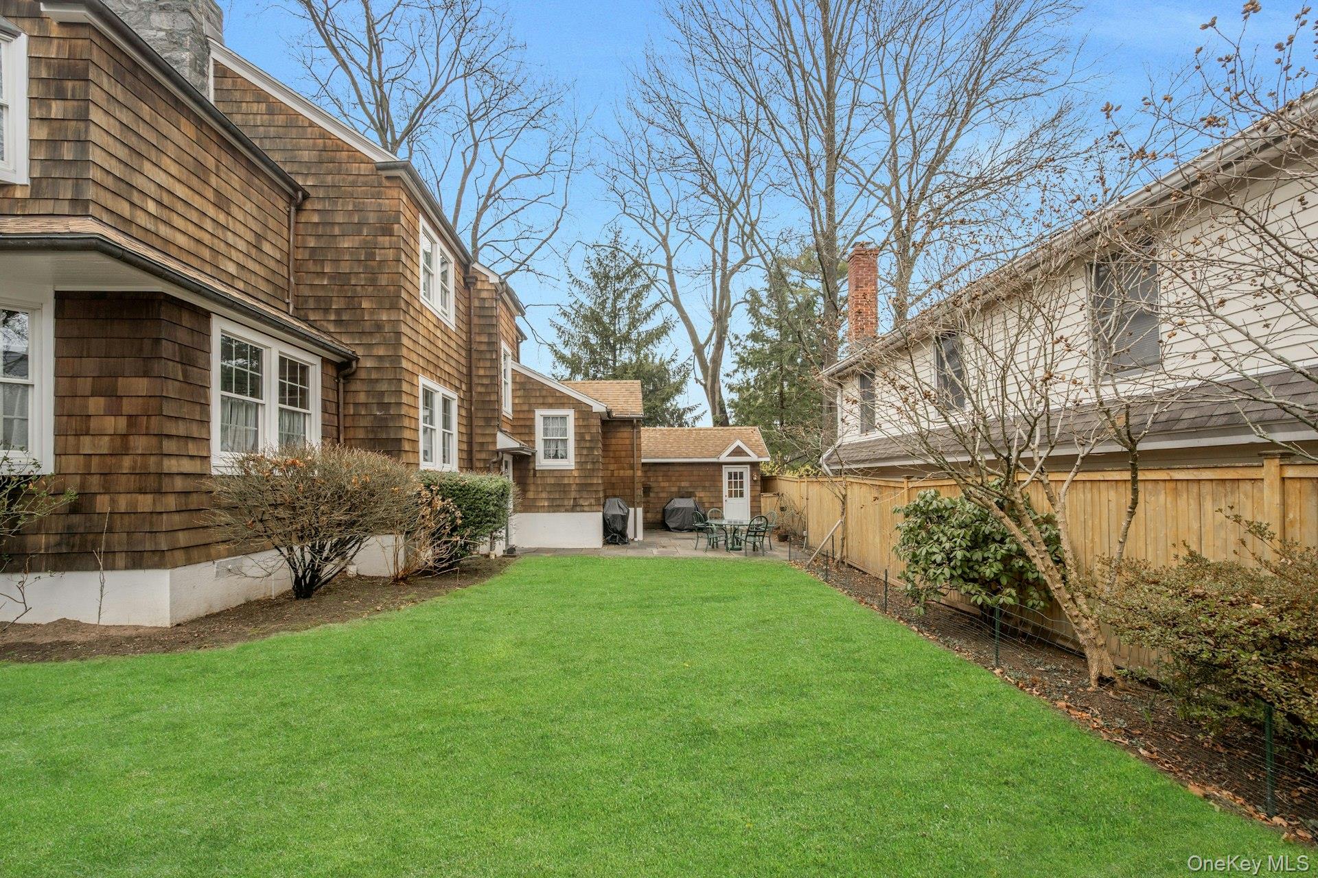 343 Rye Beach Avenue Rye, NY 10580 - Photo 32 of 35 a view of a house with a yard and sitting area