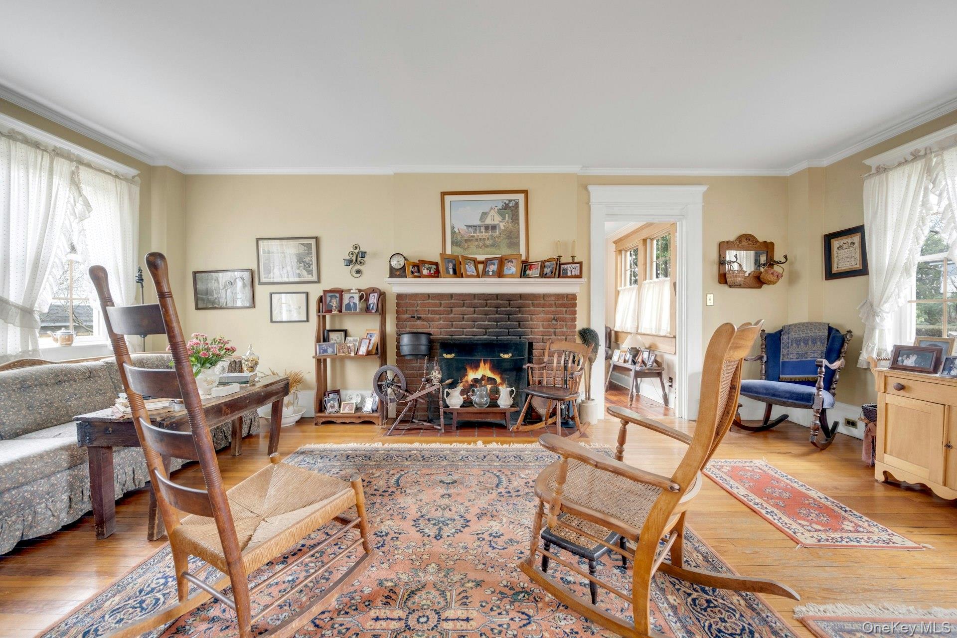 343 Rye Beach Avenue Rye, NY 10580 - Photo 5 of 35 a view of a livingroom with furniture and a fireplace