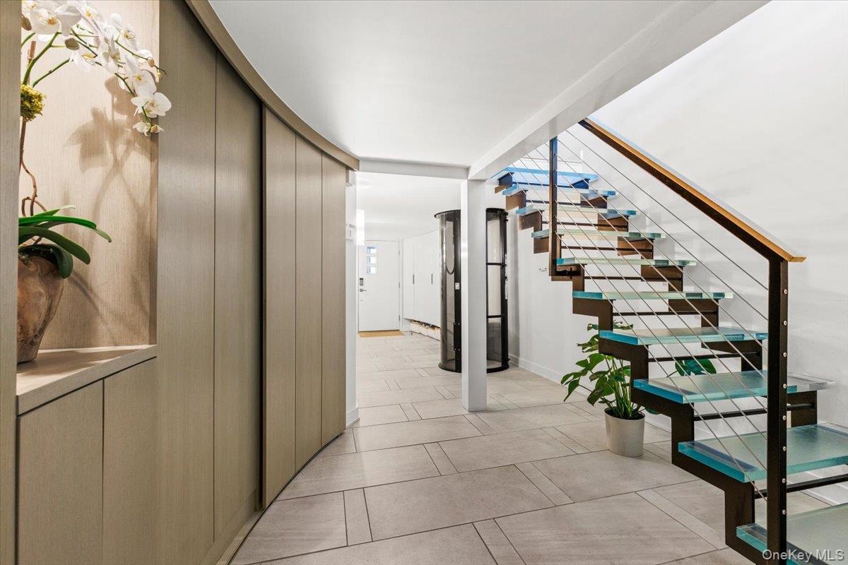 720 Milton Road, Unit F5 Rye, NY 10580 - Photo 4 of 32 Custom glass stairs; curved wall