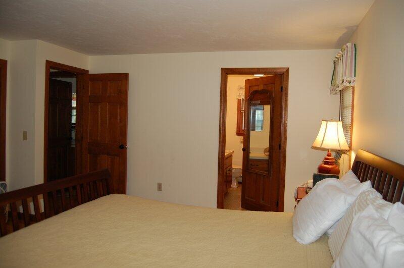 27 Pine View Drive Brewster, MA 02631 - Photo 12 of 17 a bedroom with a bed and a mirror