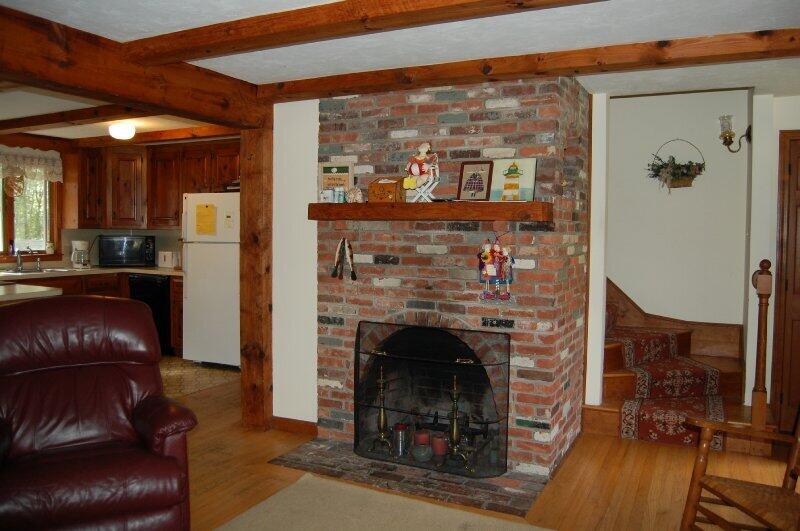 27 Pine View Drive Brewster, MA 02631 - Photo 5 of 17 a living room with furniture and a fireplace