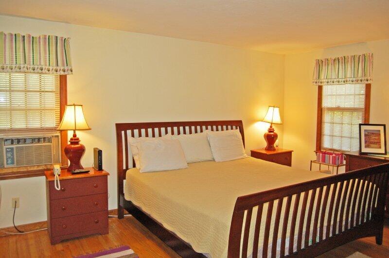 27 Pine View Drive Brewster, MA 02631 - Photo 10 of 17 a bedroom with a bed and windows