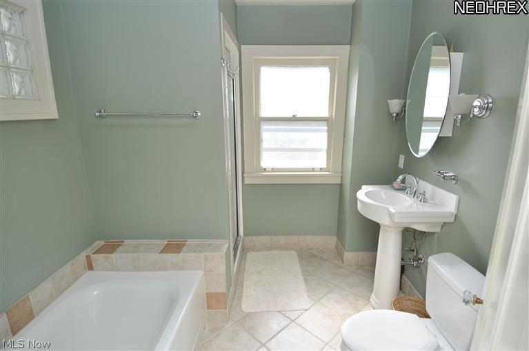 2519 Queenston Road Cleveland, OH 44118 - Photo 13 of 14 Large bathroom with ceramic tile, separate shower and bathtub
