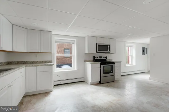 a view of livingroom with furniture and window