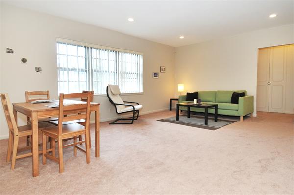 120 Lake Shore Road, Unit 1 Boston, MA 02135 - Photo 2 of 15 a living room with furniture and a flat screen tv