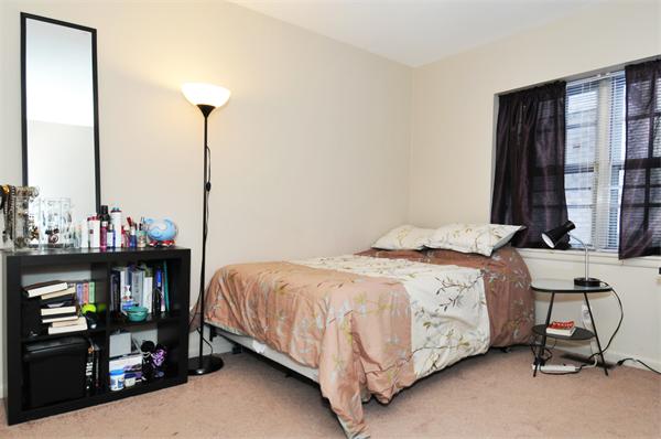 120 Lake Shore Road, Unit 1 Boston, MA 02135 - Photo 4 of 15 a bedroom with a bed and window