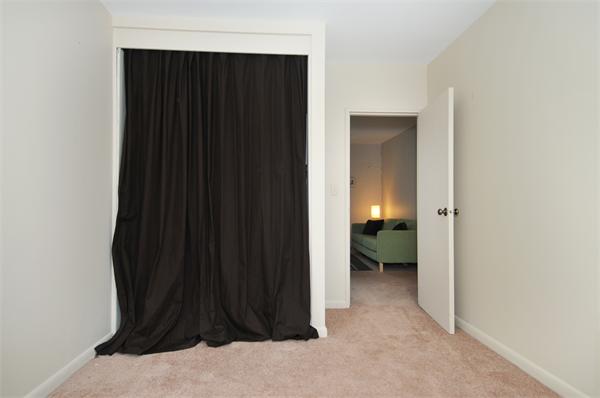 120 Lake Shore Road, Unit 1 Boston, MA 02135 - Photo 8 of 15 a view of a closet area with living room