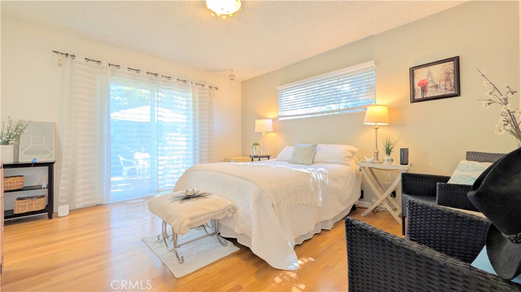 1418 Niagara Avenue Claremont, CA 91711 - Photo 22 of 29 a spacious bedroom with a bed and wooden floor