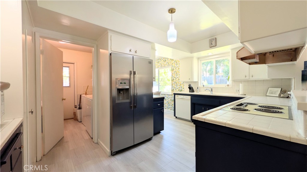1418 Niagara Avenue Claremont, CA 91711 - Photo 9 of 29 a kitchen with stainless steel appliances a sink stove and refrigerator