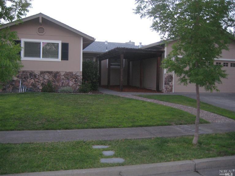 5041 Gregory Court Santa Rosa, CA 95409 - Photo 1 of 1 a view of a yard in front of a house with large windows