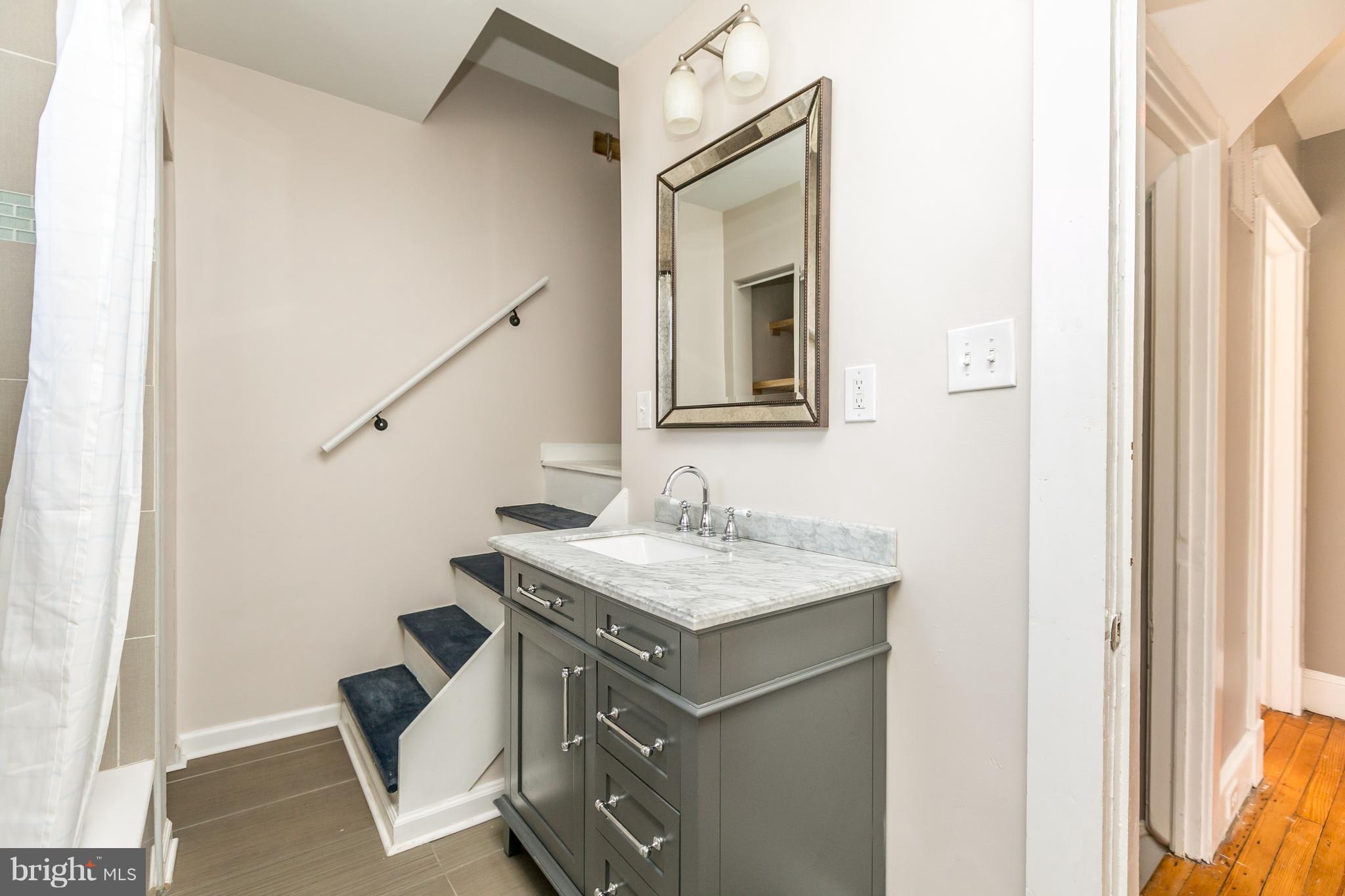 5213 Catalpha Road Baltimore, MD 21214 - Photo 24 of 30 Bath upper level w/stairs to finished attic