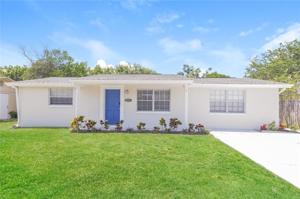 a front view of house with yard and seating area