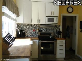 6899 Broadview Road Independence, OH 44131 - Photo 7 of 18 Kitchen with newer cabinetry & stainless steel appliances