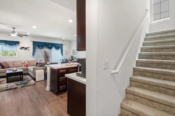 a view of living room with furniture and a fireplace