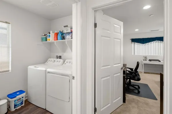 a view of storage and utility room with washer and dryer