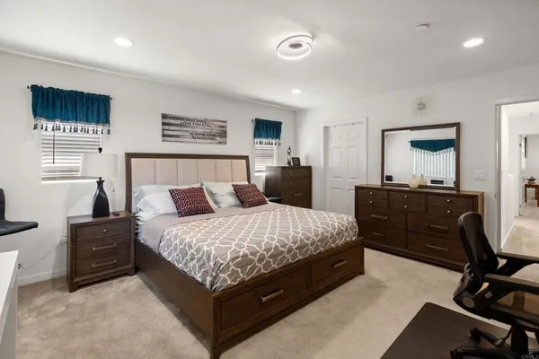 a living room with a bed and furniture