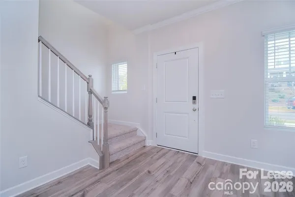 a view of entryway with wooden floor