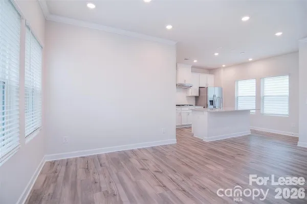 a view of kitchen with wooden floor and window