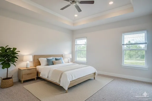 a bedroom with a bed window and potted plant
