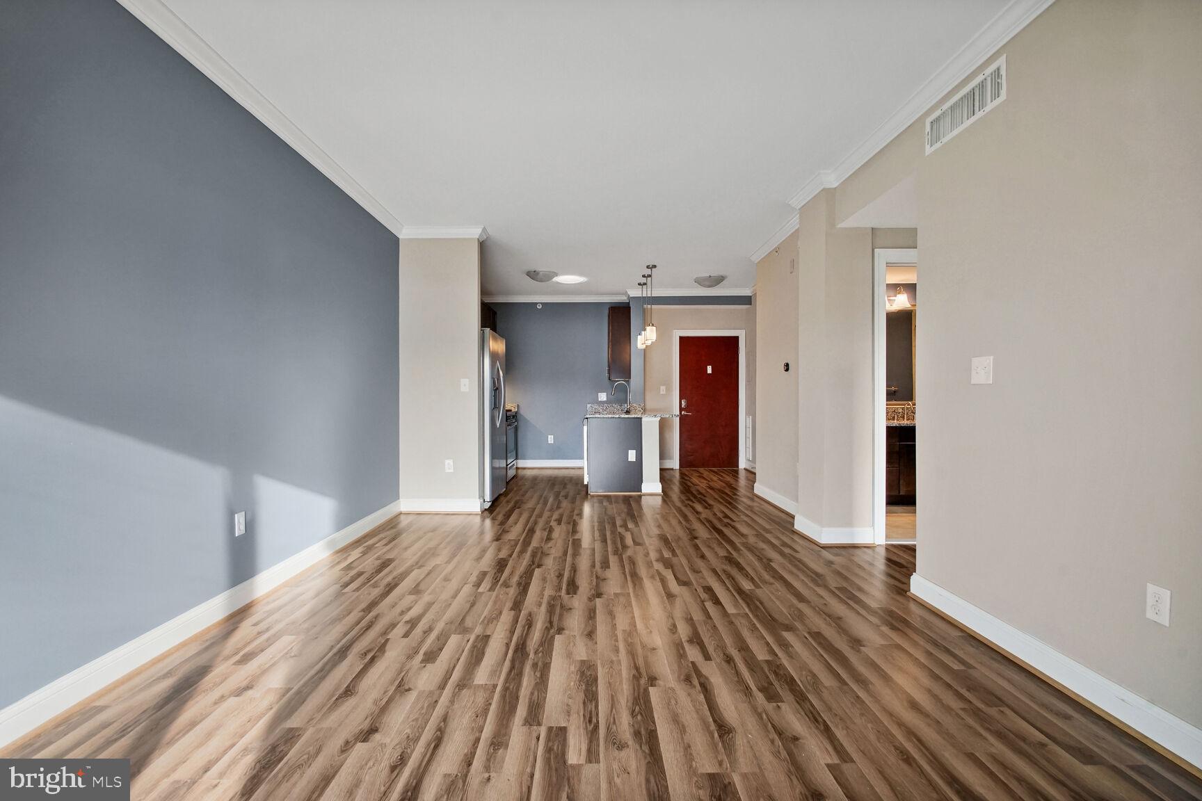 6301 Edsall Road, Unit 423 Alexandria, VA 22312 - Photo 9 of 21 Spacious living room looking into kitchen