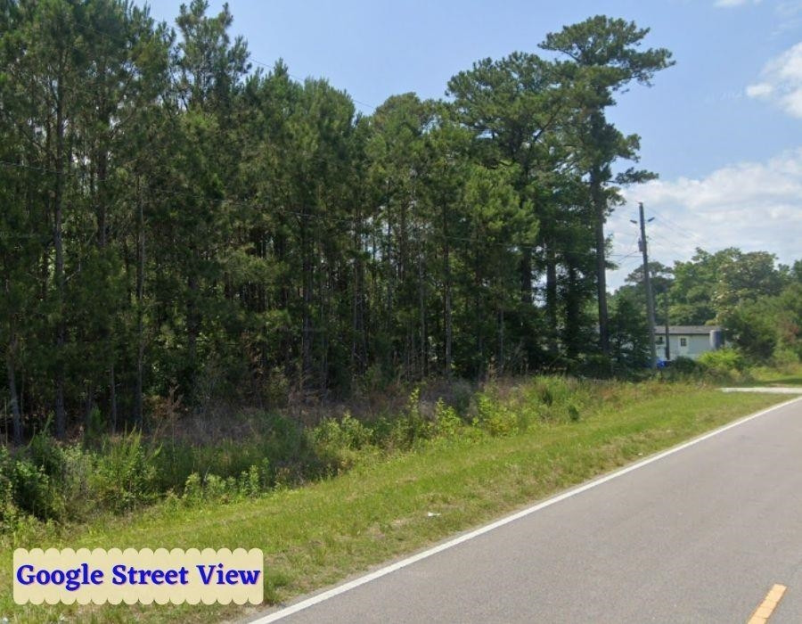 Tbd Walton Road Midway Park, NC 28544 - Photo 14 of 19 a view of a sign in front of a garden