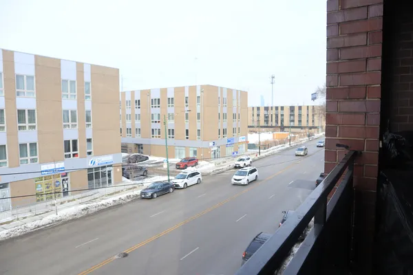 a view of balcony with seating space and city view