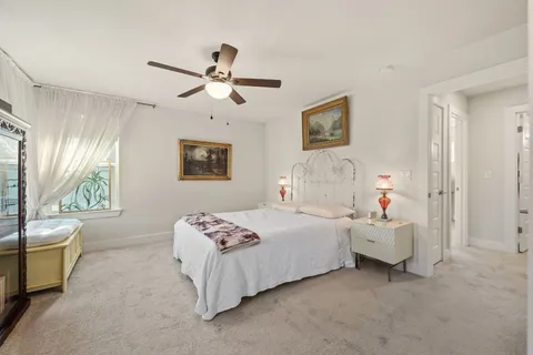 a bedroom with bed and window