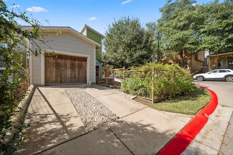 a view of street with an entrance to other