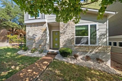 front view of a house with a yard