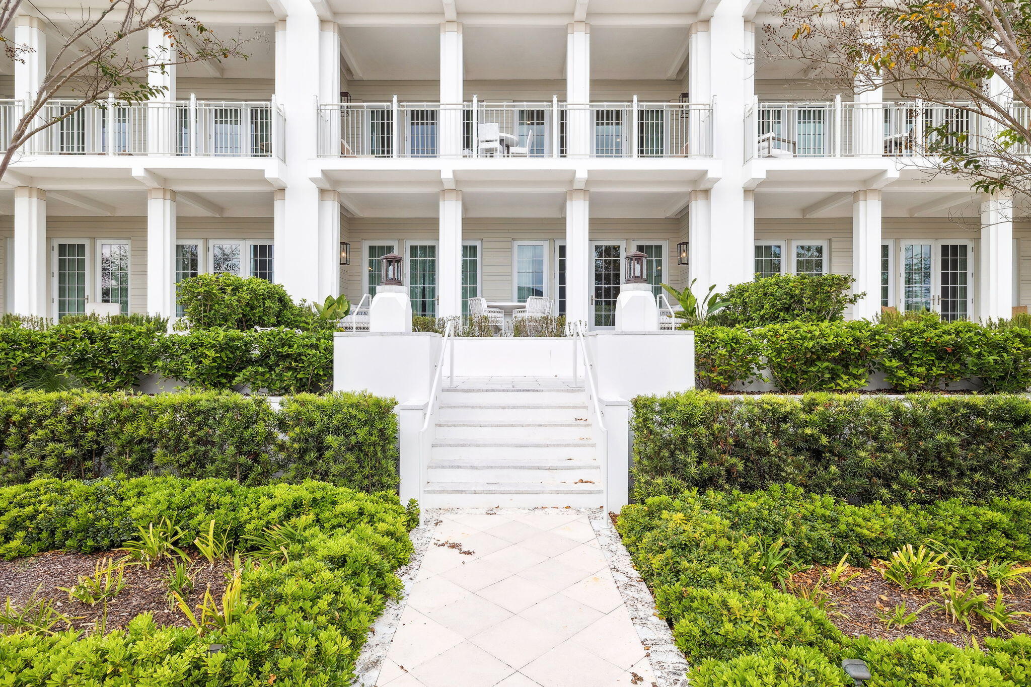 45 West Solaire Way Inlet Beach, Unit 106 Inlet Beach, FL 32461 - Photo 38 of 47 front view of a house with a garden