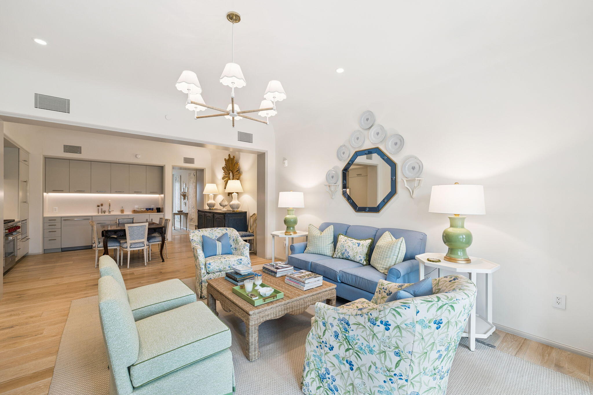 45 West Solaire Way Inlet Beach, Unit 106 Inlet Beach, FL 32461 - Photo 5 of 47 a living room with furniture a chandelier and a mirror