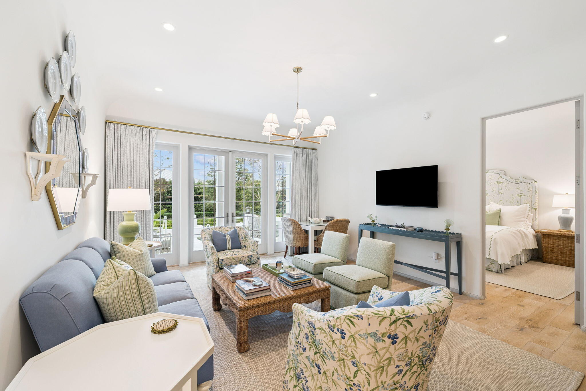 45 West Solaire Way Inlet Beach, Unit 106 Inlet Beach, FL 32461 - Photo 6 of 47 a living room with furniture a flat screen tv and a large window