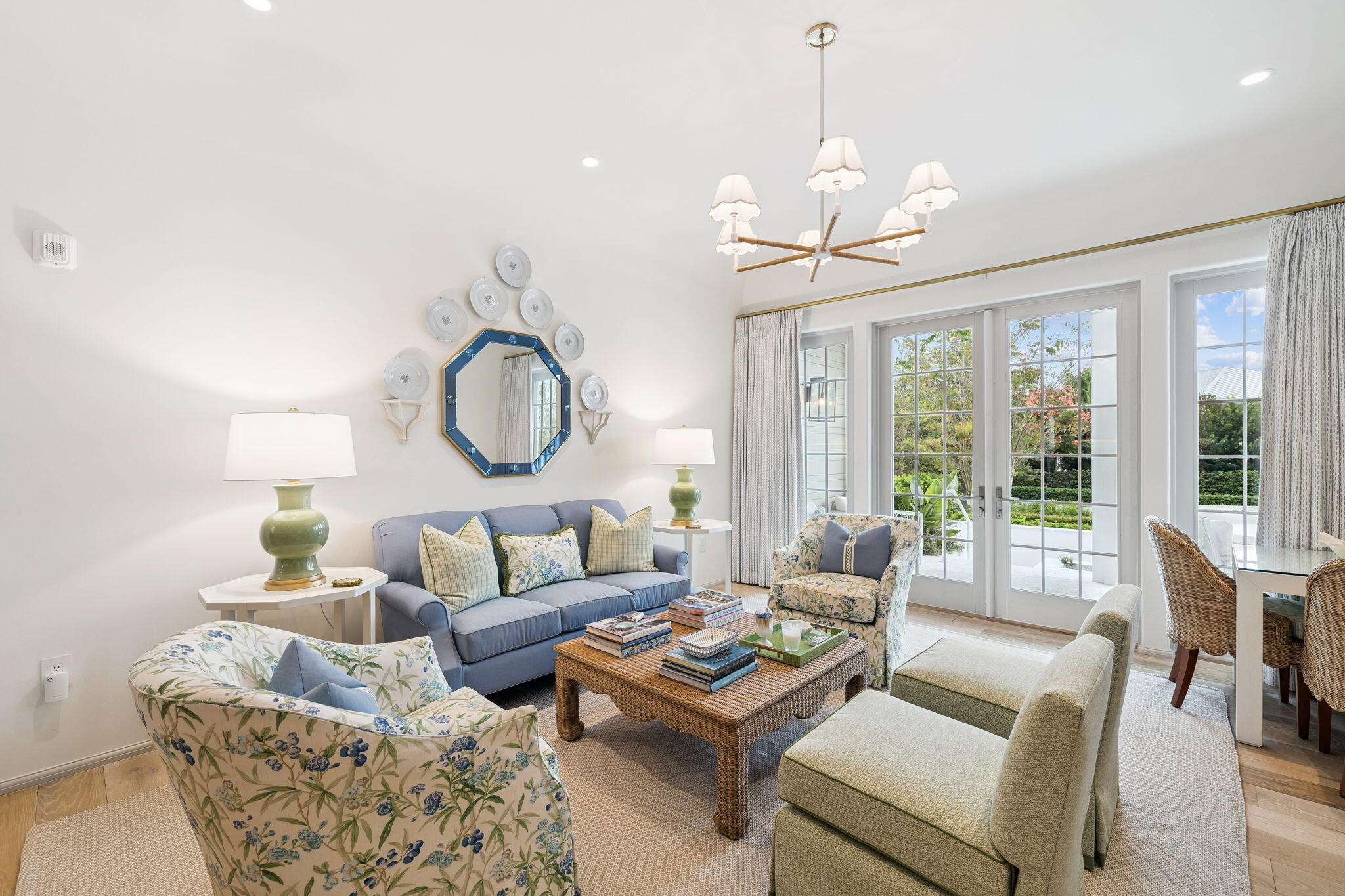 45 West Solaire Way Inlet Beach, Unit 106 Inlet Beach, FL 32461 - Photo 7 of 47 a living room with furniture a large window and a chandelier