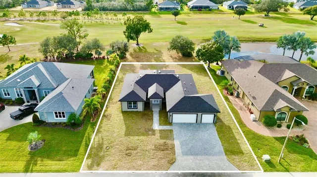 a view of an swimming pool with seating area