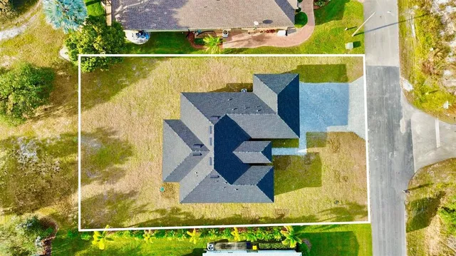 an aerial view of a swimming pool with a balcony