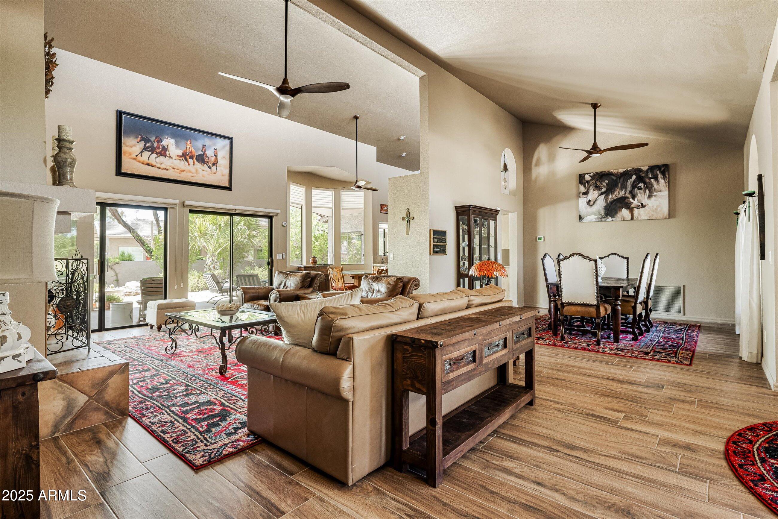 25821 North Bolero Bend Rio Verde, AZ 85263 - Photo 9 of 42 a living room with furniture large window and wooden floor