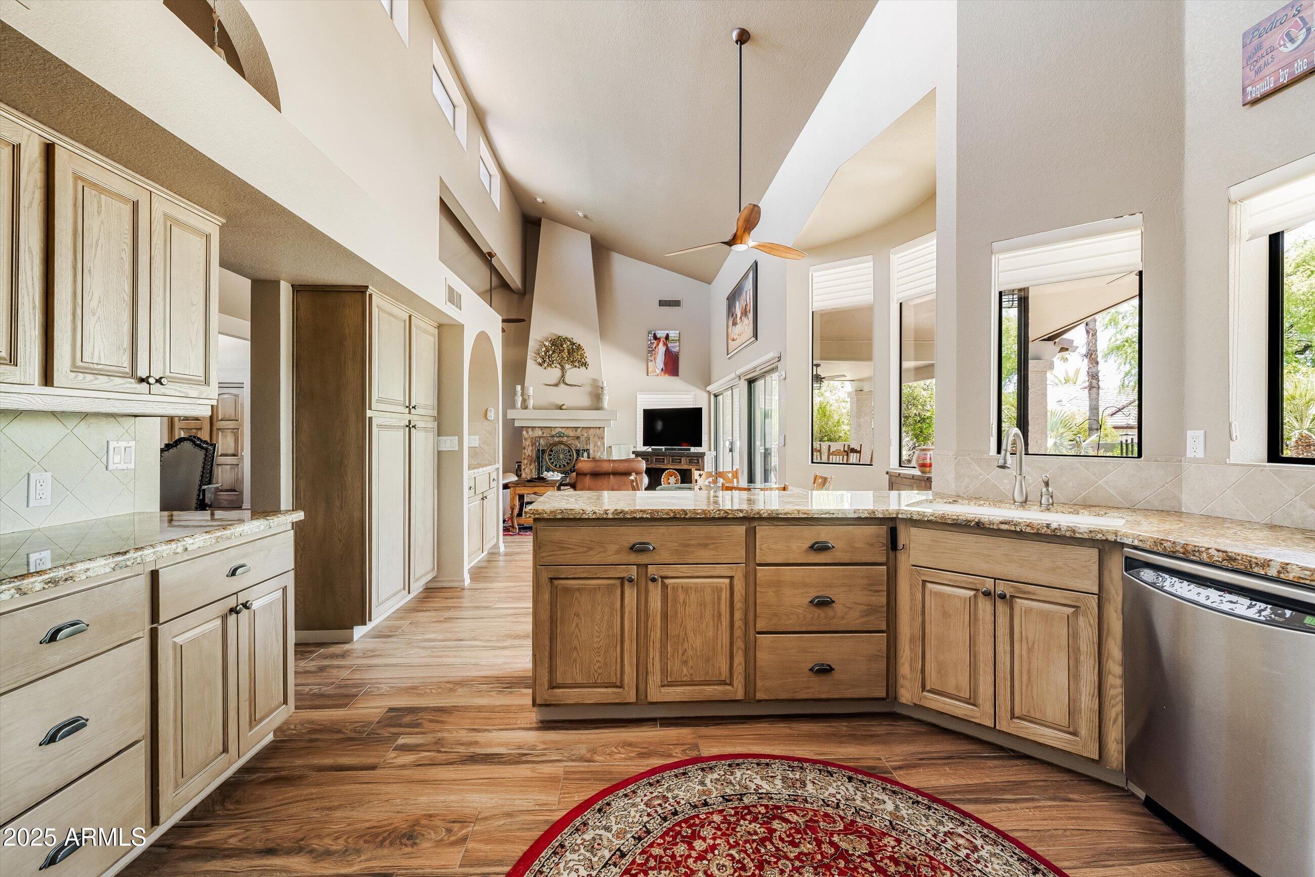 25821 North Bolero Bend Rio Verde, AZ 85263 - Photo 16 of 42 a large kitchen with a lot of counter space and wooden floor
