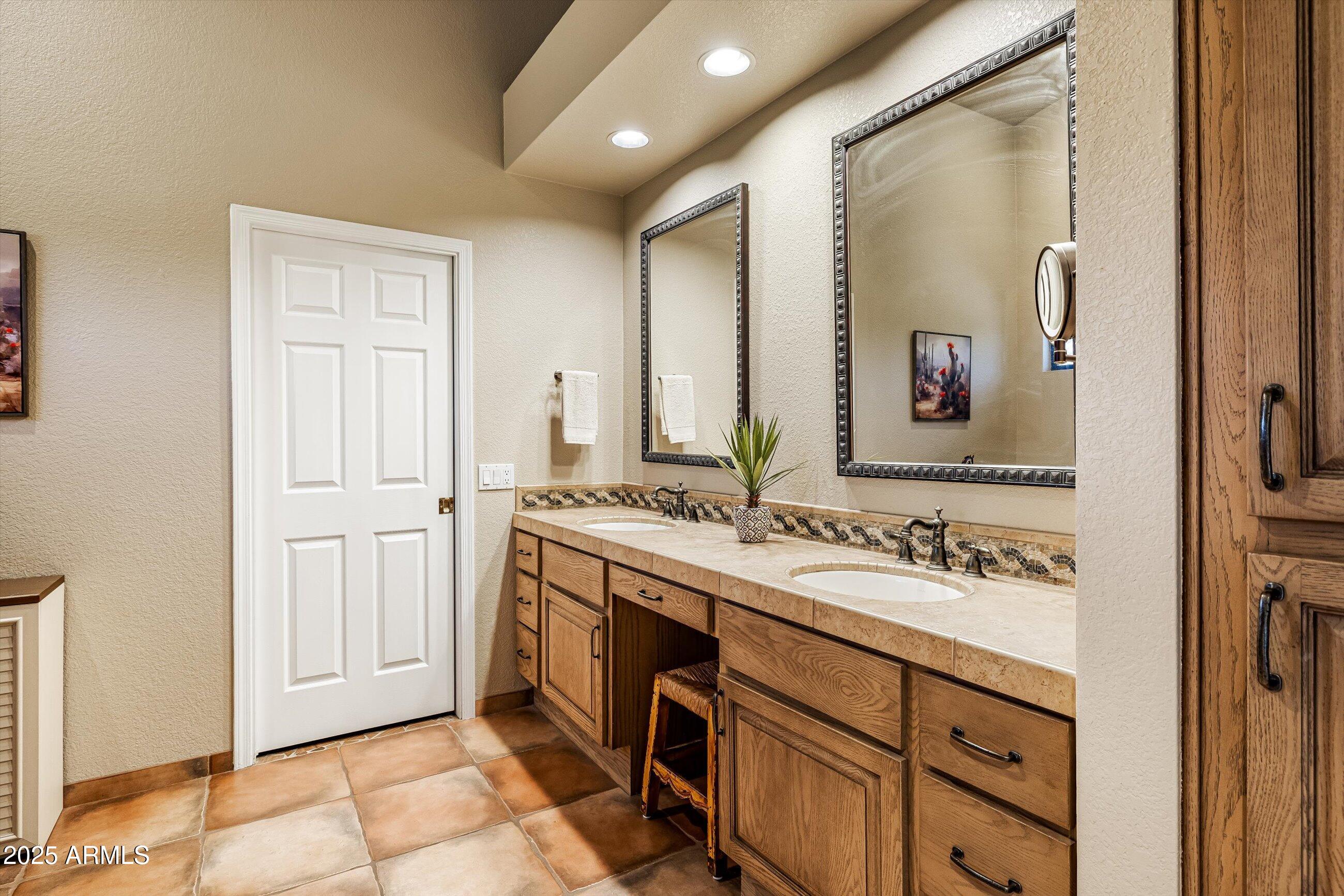 25821 North Bolero Bend Rio Verde, AZ 85263 - Photo 19 of 42 a bathroom with a sink and a mirror