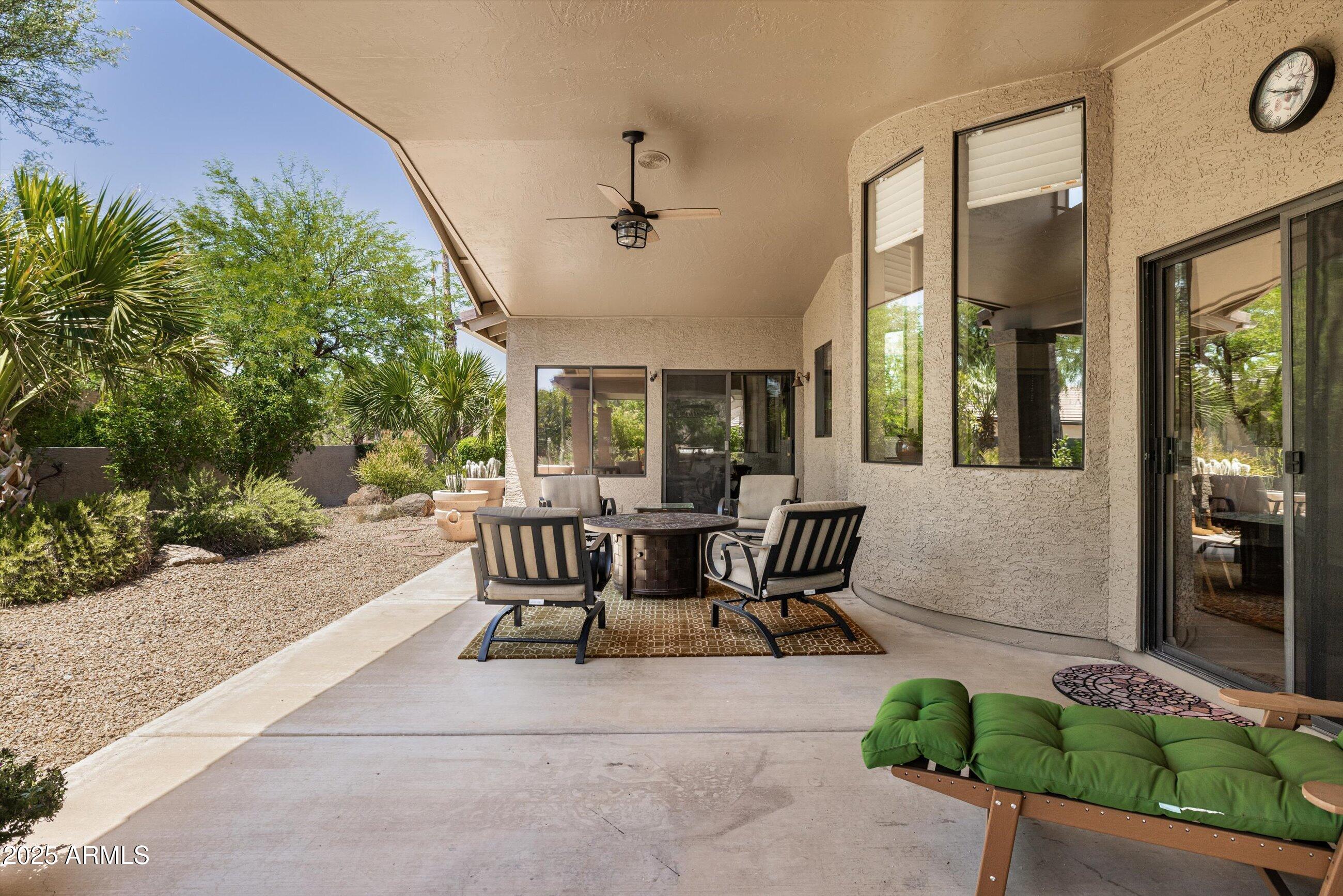 25821 North Bolero Bend Rio Verde, AZ 85263 - Photo 24 of 42 a view of a patio with table and chairs and potted plants