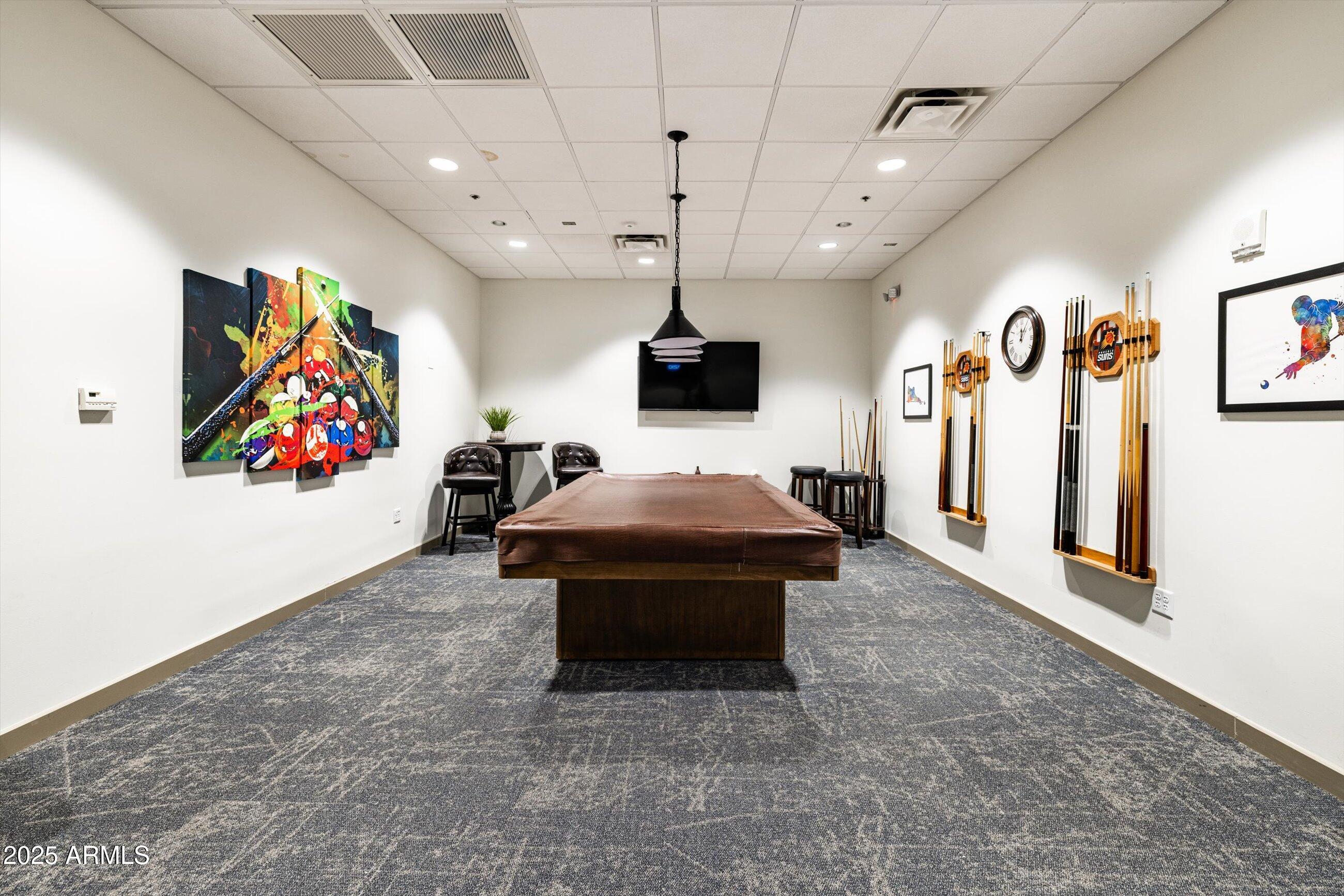25821 North Bolero Bend Rio Verde, AZ 85263 - Photo 36 of 42 a living room with furniture and a flat screen tv
